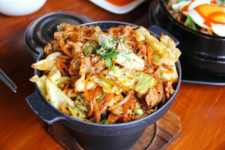 cooked food on black bucket